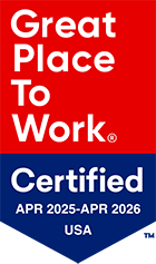A badge reading "Great Place To Work Certified APR 2025–APR 2026 USA" with a red upper section and a blue lower section.